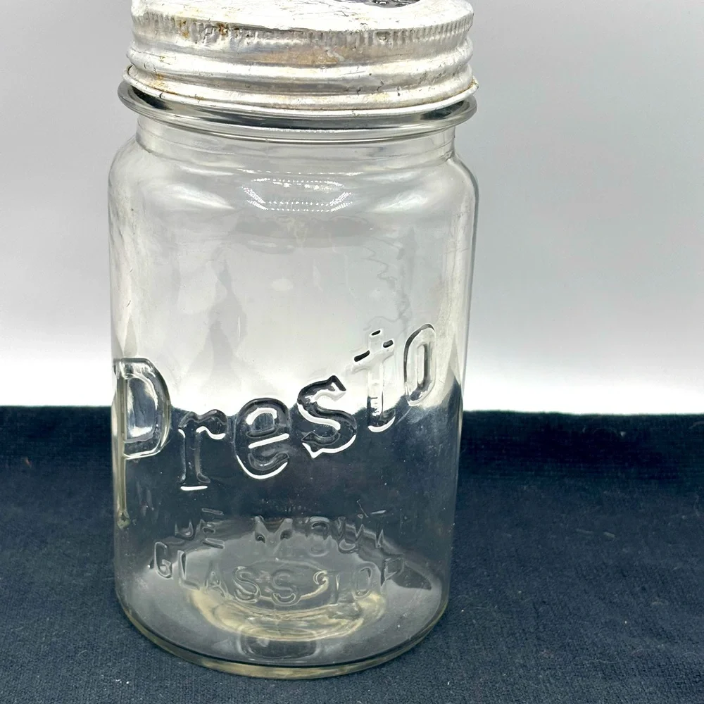 VTG. Rare Presto wide mouth cylindrical shape qt. Jar with glass bow tie lid.